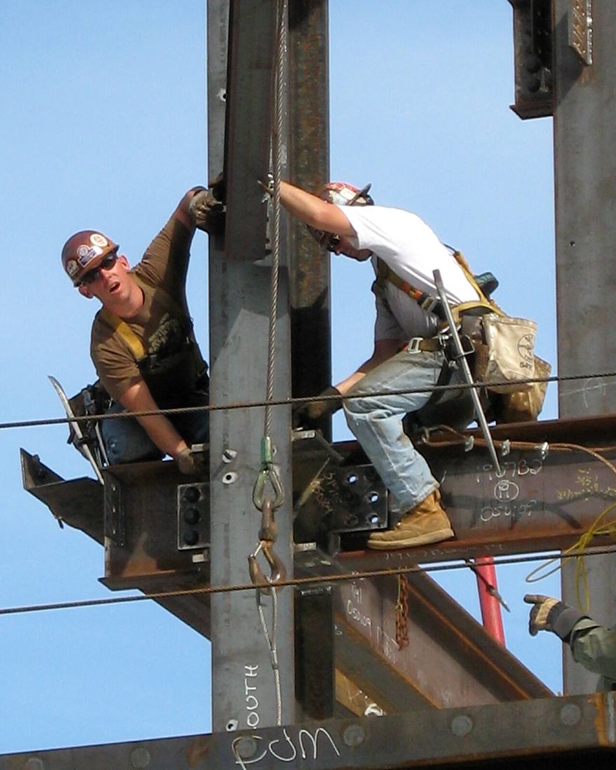Construction workers on a job site. SSDI covers workers in jobs covered by Social Security, from construction to offices. Photo: Wikimedia Commons, CC BY 2.0.
