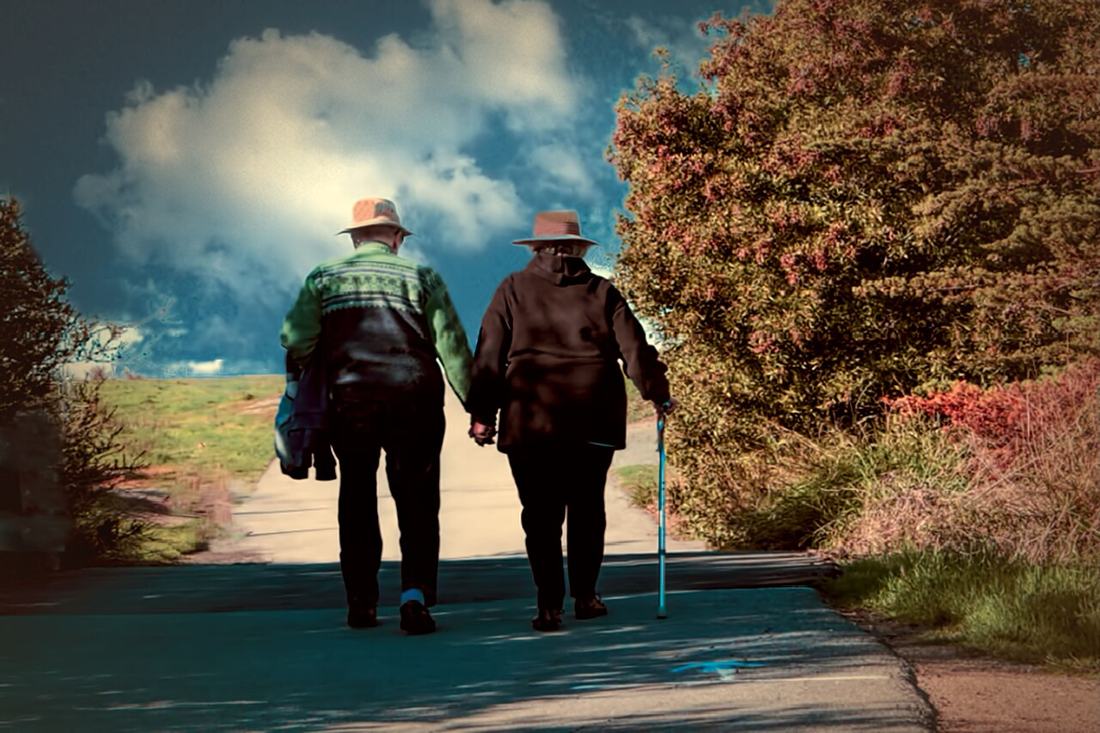 A couple walking outdoors. After approval, life continues — with reviews and reporting duties alongside it. Photo: Wikimedia Commons, CC BY 2.0.